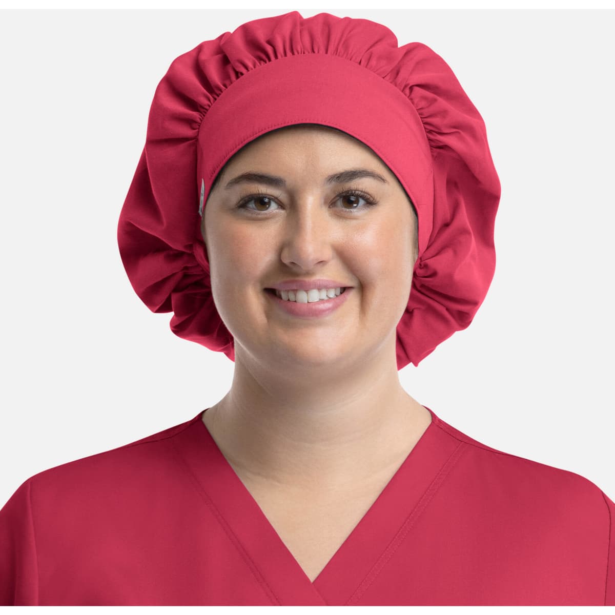 A unisex bouffant scrub cap in bright pink, featuring a gathered design and a wide band.