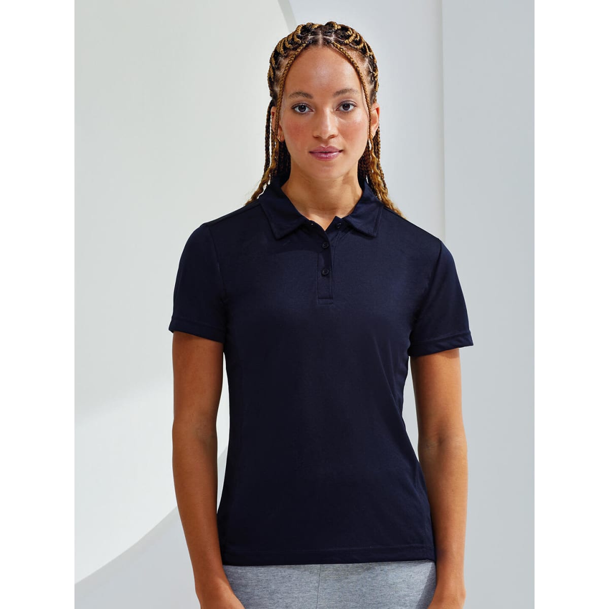 A navy blue panelled polo shirt designed for a fitted look, featuring a collar and buttons.