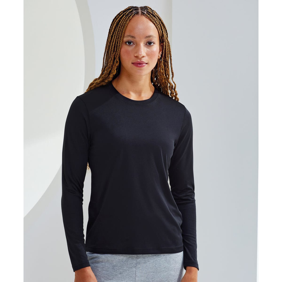 A long sleeve performance T-shirt in black, featuring a fitted design and a crew neckline.