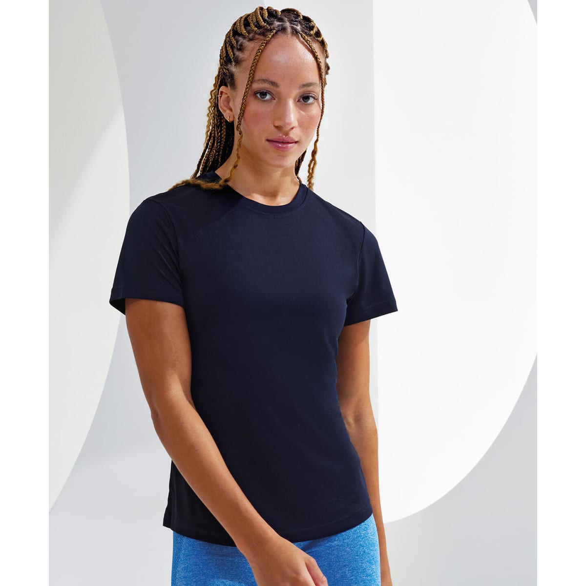 A black performance t-shirt displayed on a model, featuring short sleeves and a fitting design.