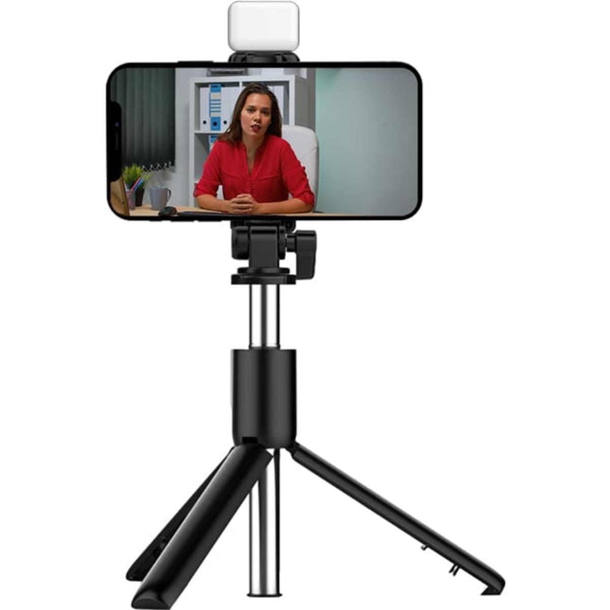 A black LED selfie stand with a tripod base, holding a smartphone displaying a video call.