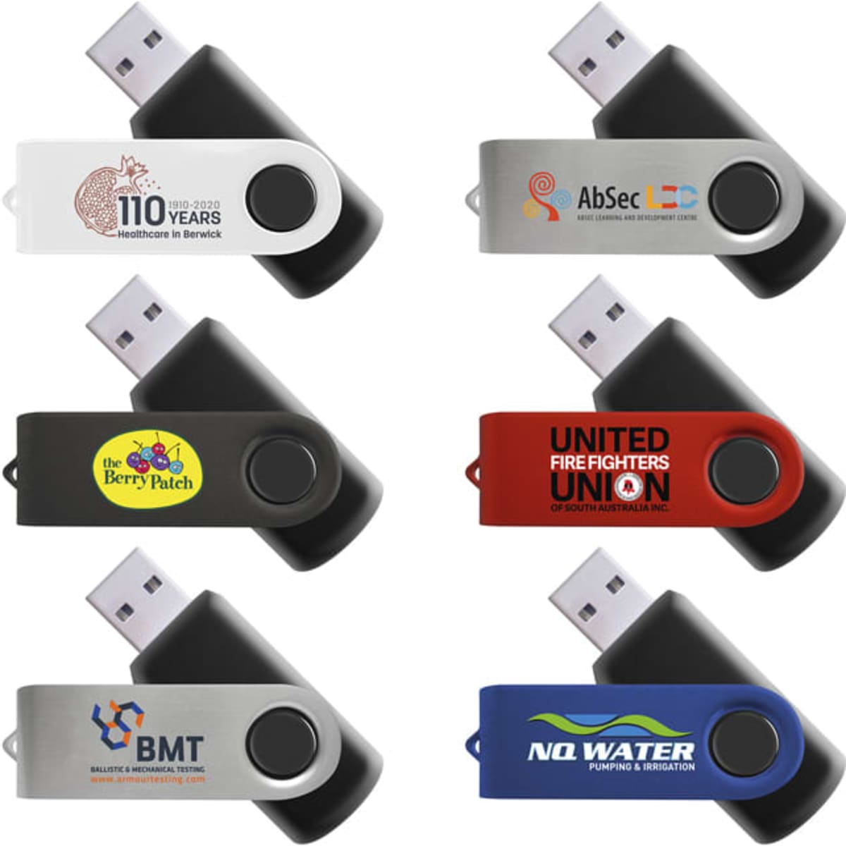 A collection of six mixed flash drives in various colours, featuring different logos and designs.
