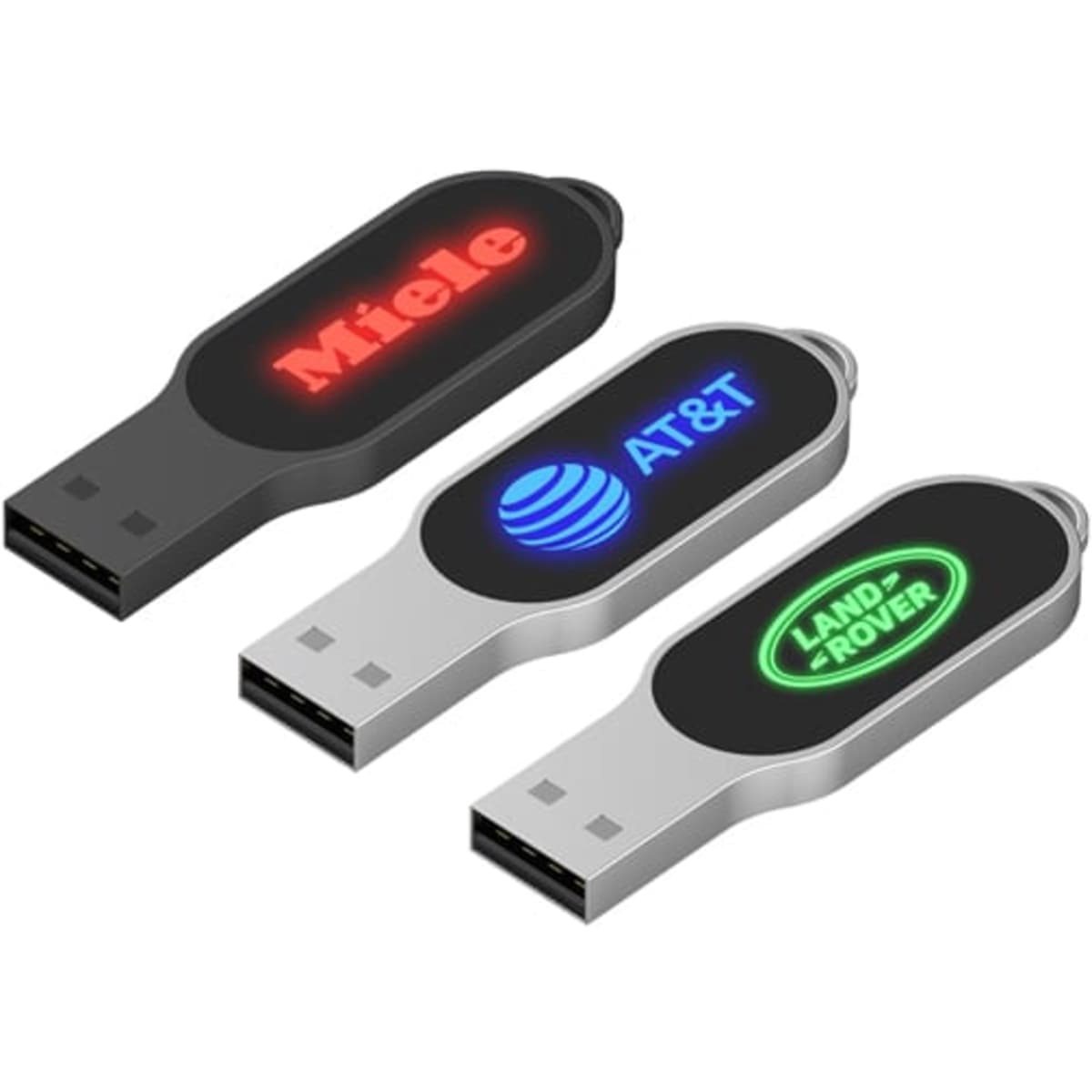 Three LED flash drives in black and silver, featuring logos on their sides in red and green illumination.