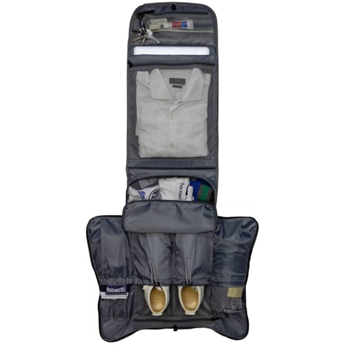 A grey backpack with multiple compartments, including space for shoes, clothing, and accessories. It features a logo.