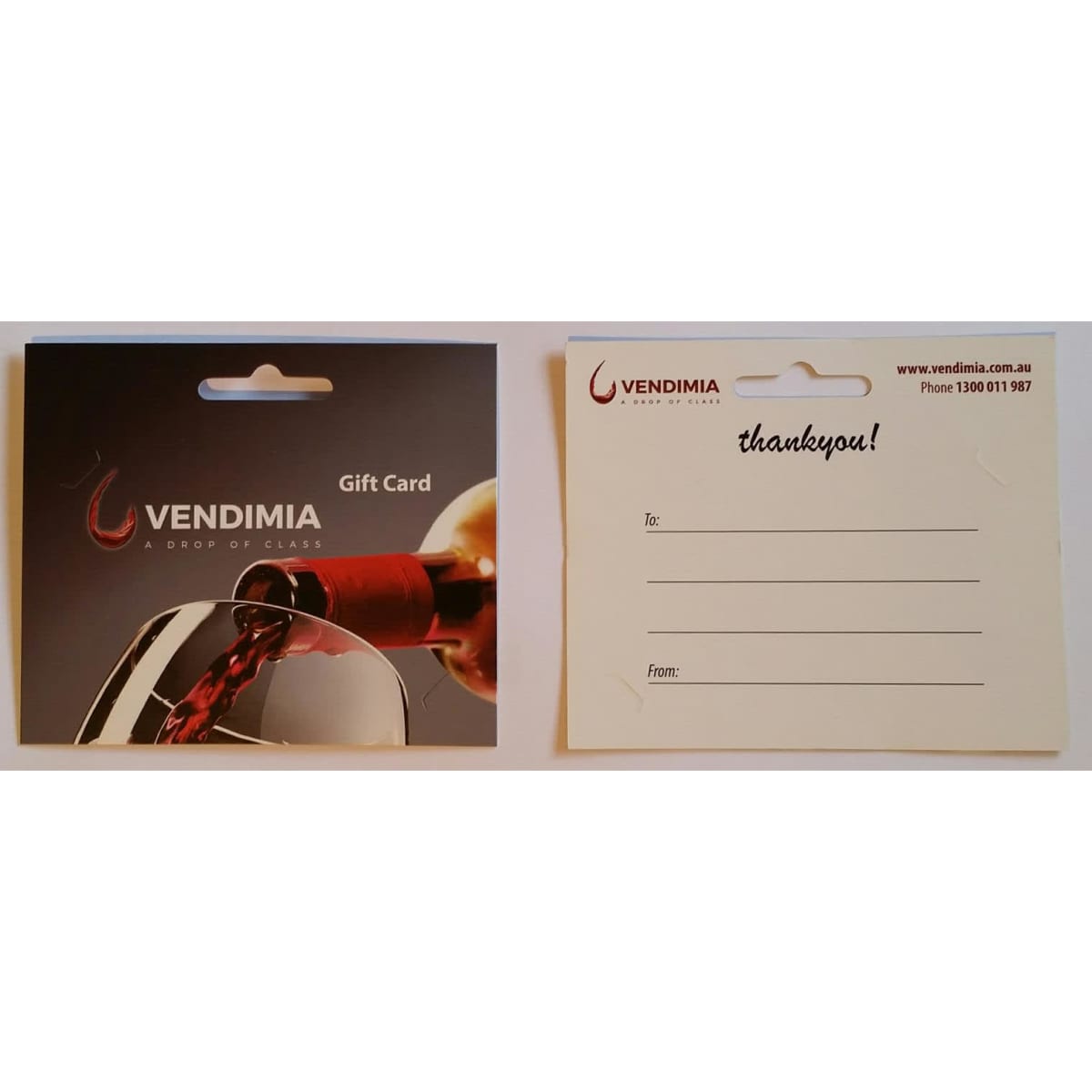 A gift card holder featuring a dark background with a wine bottle pouring into a glass, accompanied by a branding logo.