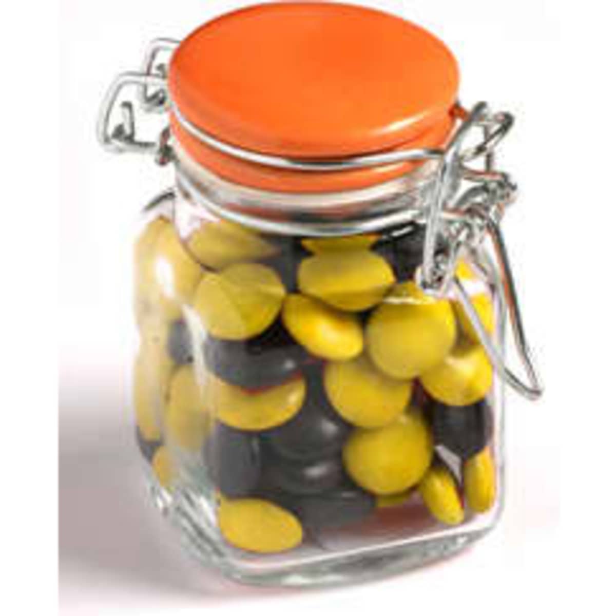 A glass clip lock jar filled with yellow and black choc beans, featuring an orange lid.