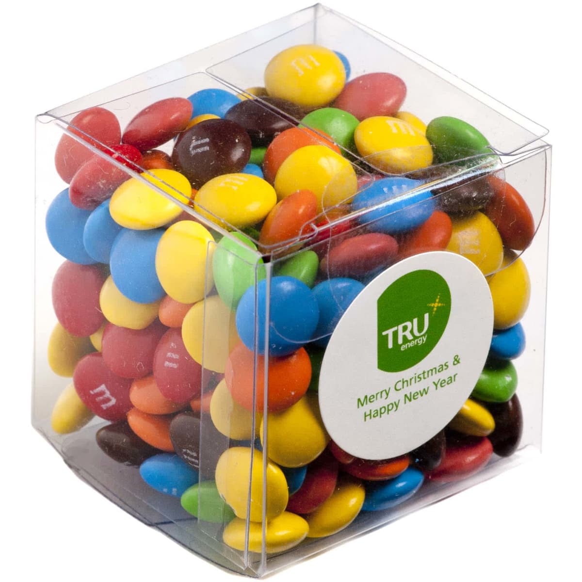 A clear cube filled with colourful M&Ms in various shades, featuring a logo.