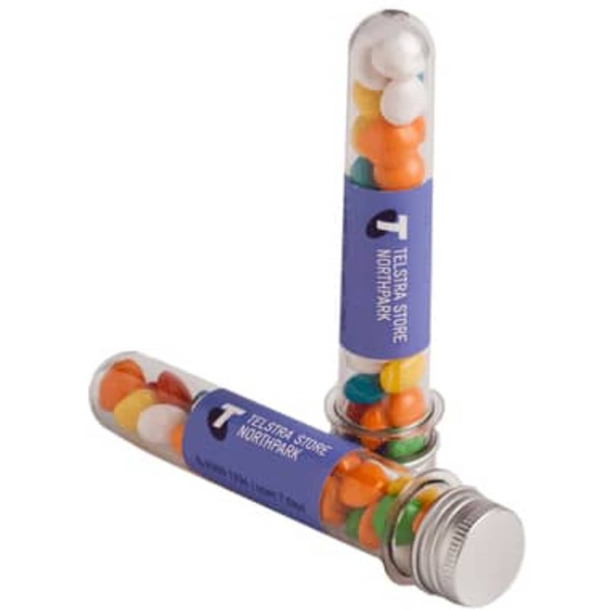 A test tube filled with colourful chewy fruit sweets, featuring a silver cap and a logo on the side.