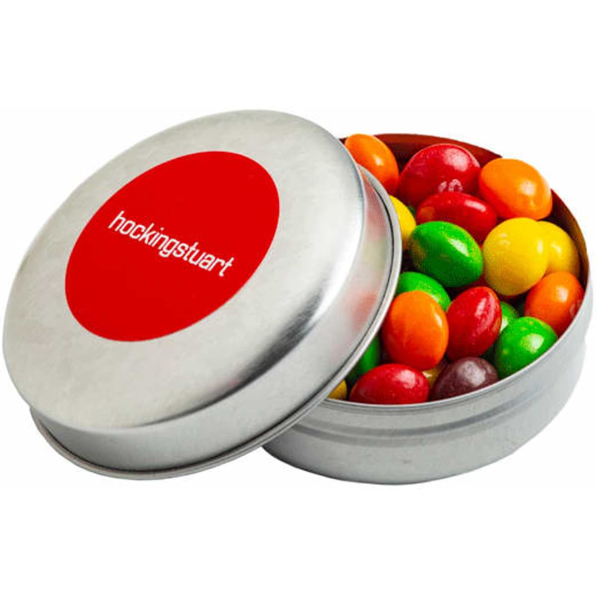 A silver tin filled with colourful Skittles—red, orange, yellow, green, and purple. It features a round logo on the lid.