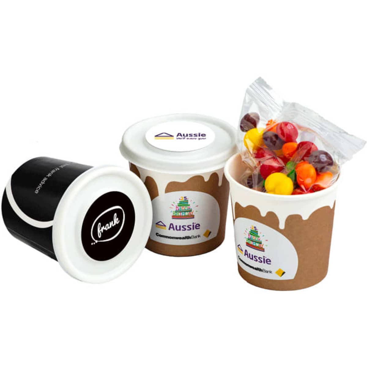 A coffee cup trio featuring brown, black, and a colourful assortment of Skittles inside a clear packet.