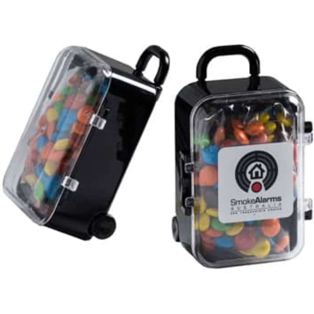A black carry-on case filled with colourful M&Ms, featuring a transparent lid and a handle.