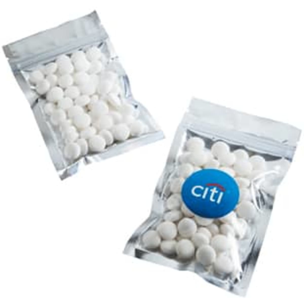 Silver zip lock bags containing white mints, featuring a logo on one of the bags.