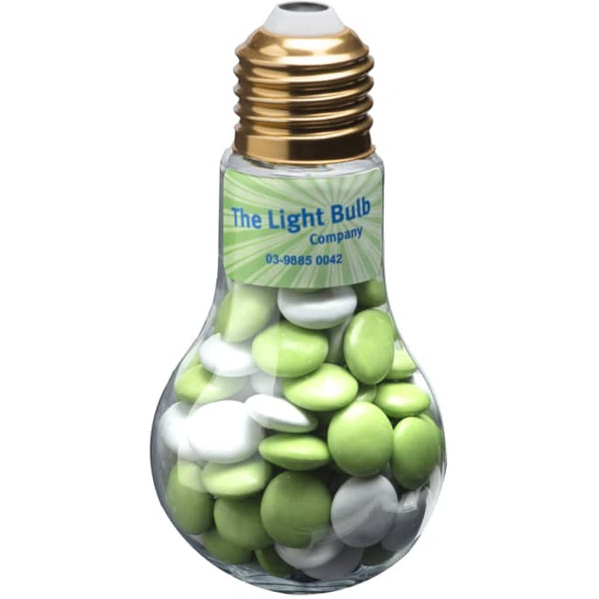 A light bulb-shaped container filled with green and white chocolate beans, featuring a gold-coloured top and a logo.