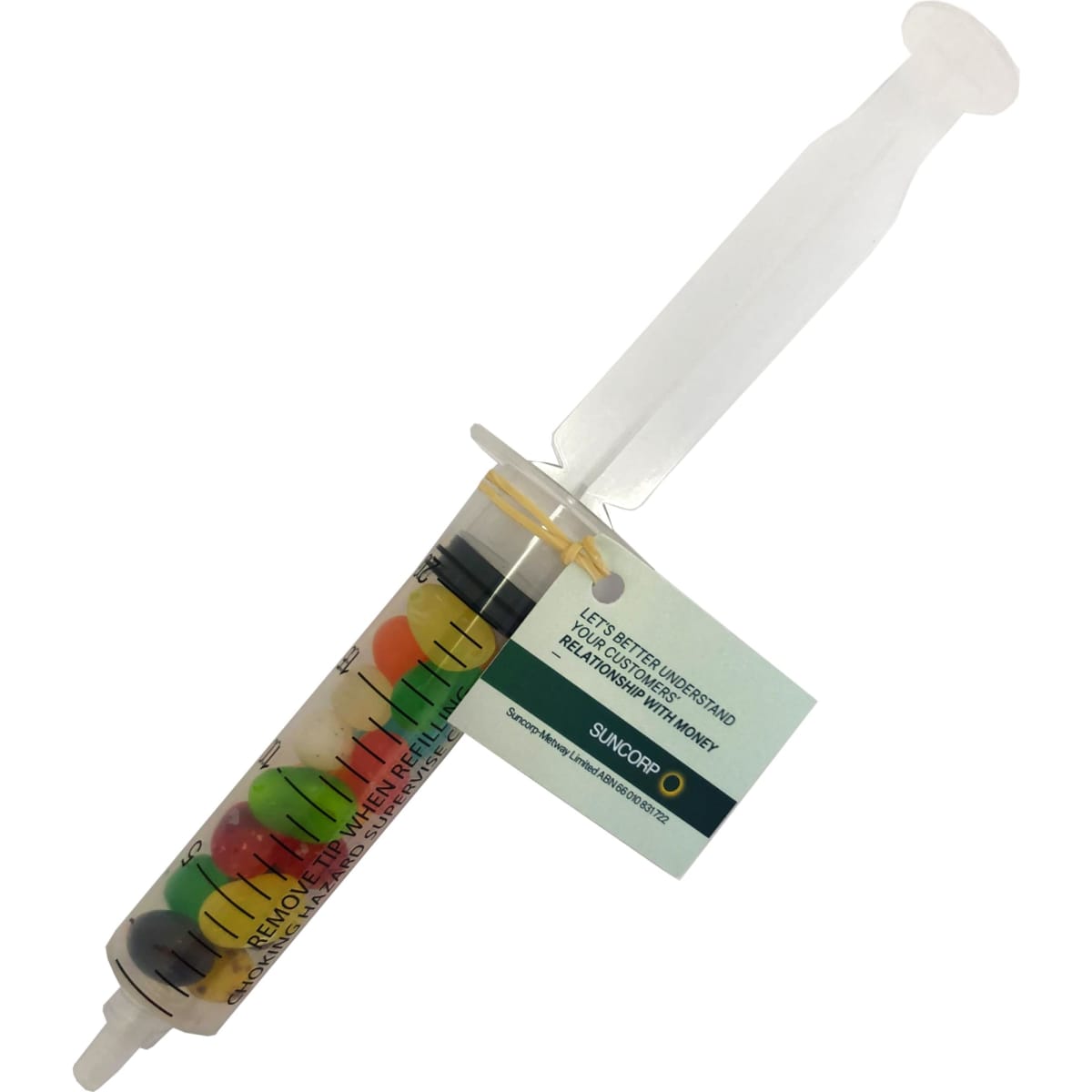 A syringe filled with multicoloured JELLY BELLY jelly beans, featuring a clear barrel and a plastic plunger.