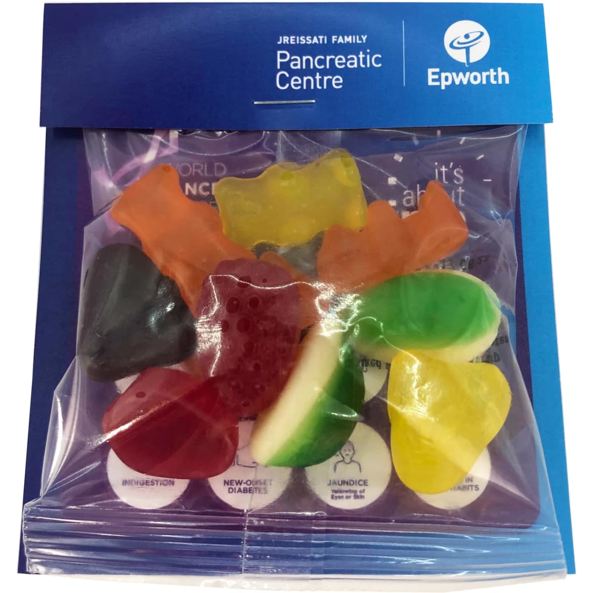 A clear bag containing assorted mixed lollies in various colours, featuring a blue header with a logo.