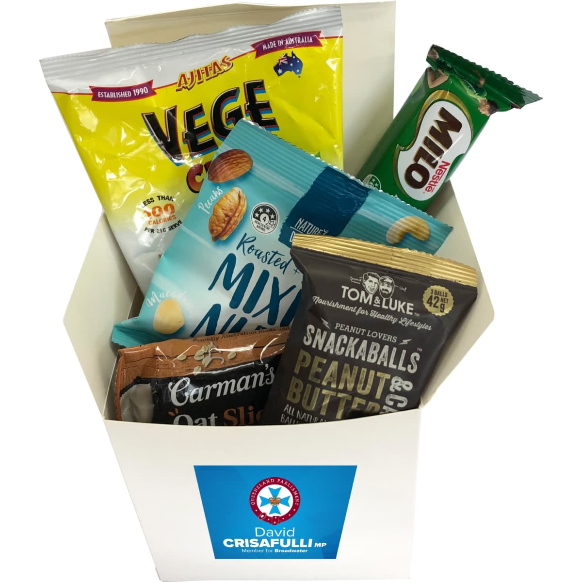 A white gift box containing various snacks such as nuts, oat slices, snack balls, and a drink. It features a logo.