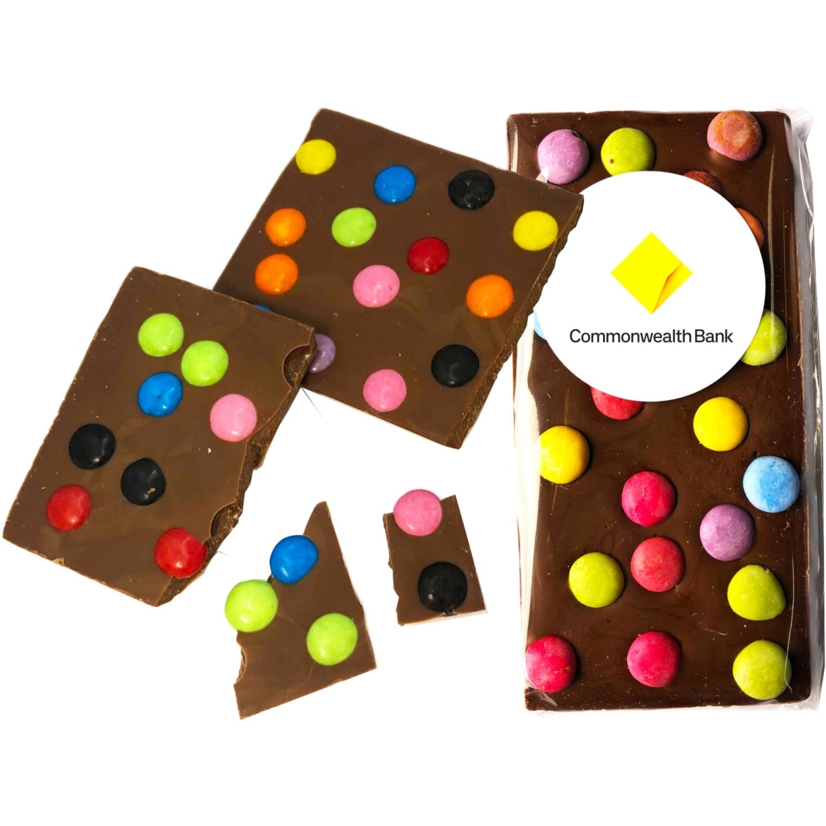 Premium chocolate bar with colourful spotty candy dots in vibrant colours on a brown chocolate background, with packaging and logo.