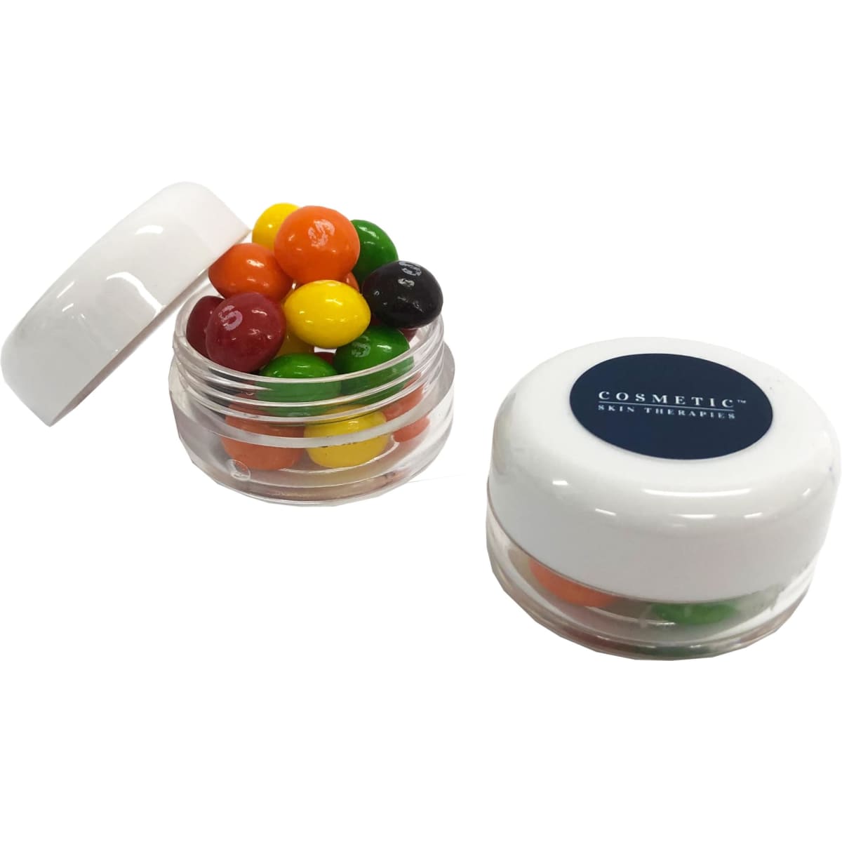 A small screw cap jar contains colourful Skittles in red, orange, yellow, green, and black, with a logo on the lid.
