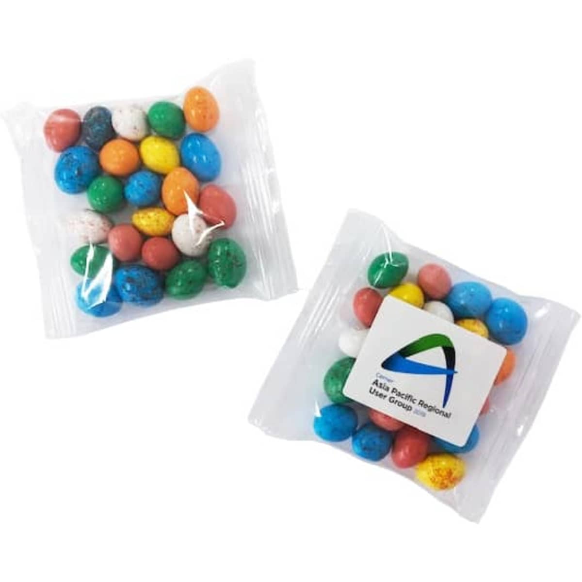 Candy coated chocolate eggs in a clear bag, featuring various colours including blue, green, orange, and white.