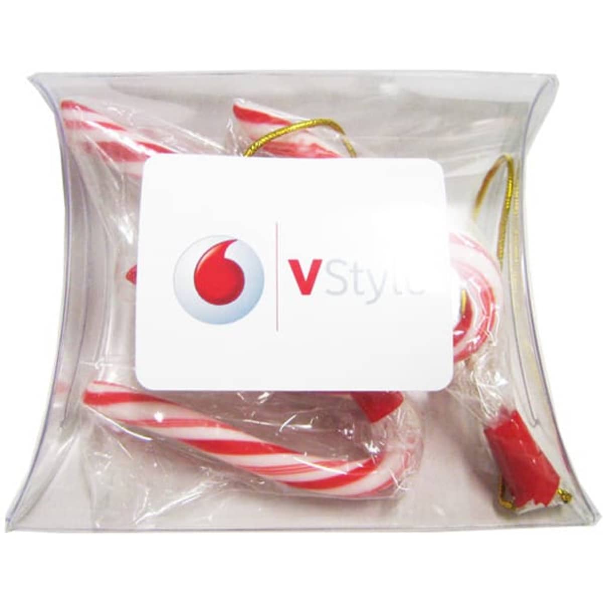 A clear pillow pack containing red and white striped candy canes, featuring a branding logo on the front.
