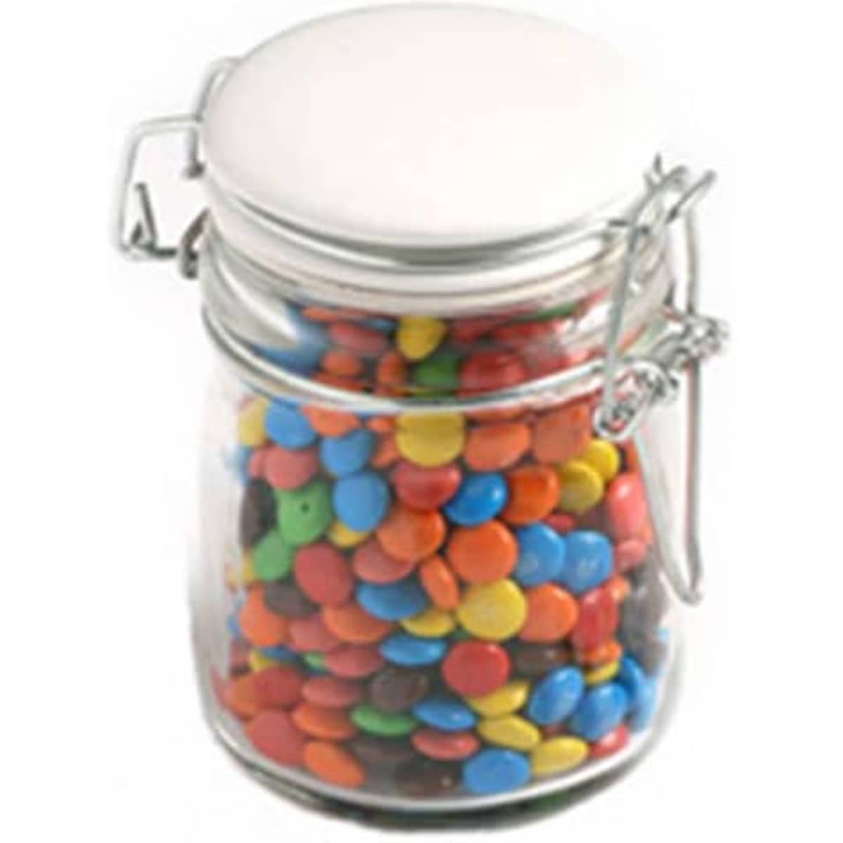 A glass clip lock jar filled with colourful M&Ms in various shades, including blue, red, yellow, and green.