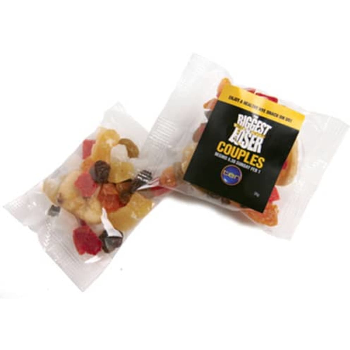 Dried fruit mix in a clear package, featuring colourful pieces of fruit, with a logo present on the packaging.
