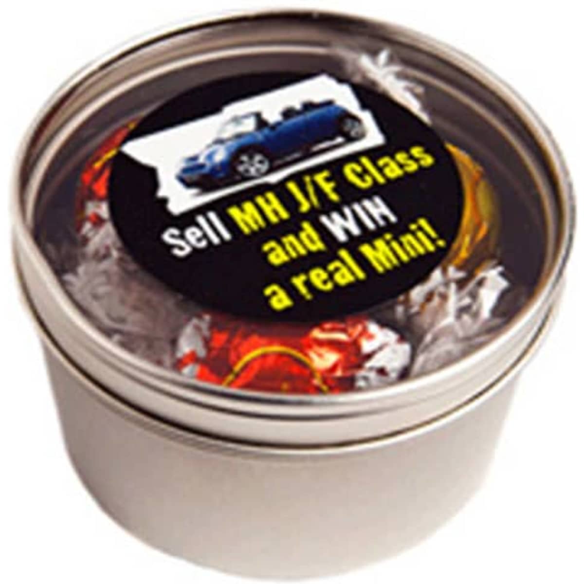 A silver round tin filled with colorful Lindt chocolate balls. The tin has a label with a logo.