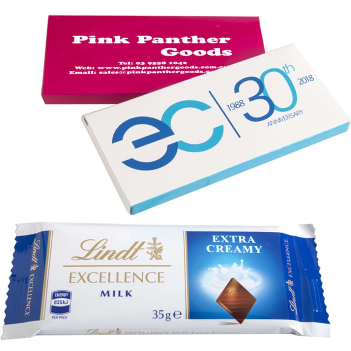 A printed box featuring a Lindt 35g chocolate bar in a blue and gold wrapper, alongside two other promotional boxes.