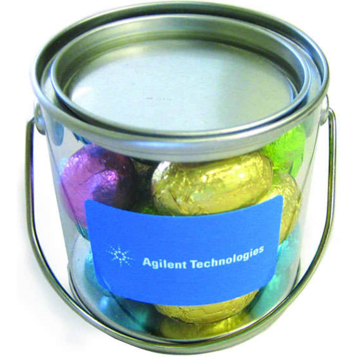 A small bucket containing mini Easter eggs wrapped in vibrant colours, featuring a silver lid and a handle.