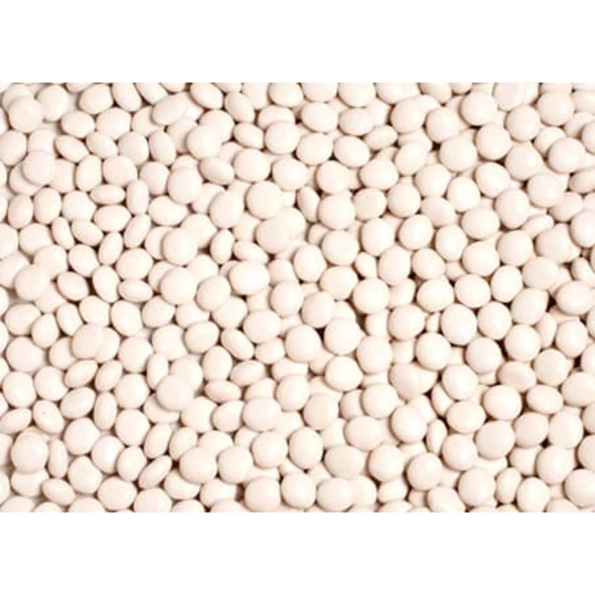 Chewy white mints piled together, forming a textured surface. The image features a branding logo.