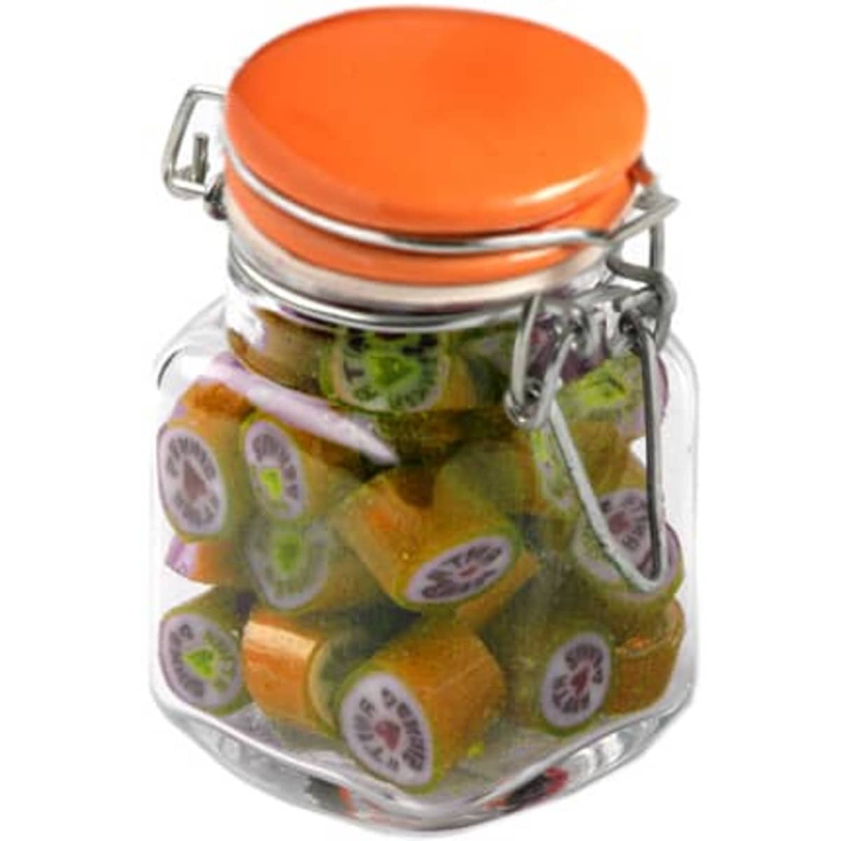 A glass jar with an orange lid filled with colourful rock candy pieces in various shapes. The jar has a metal clasp.