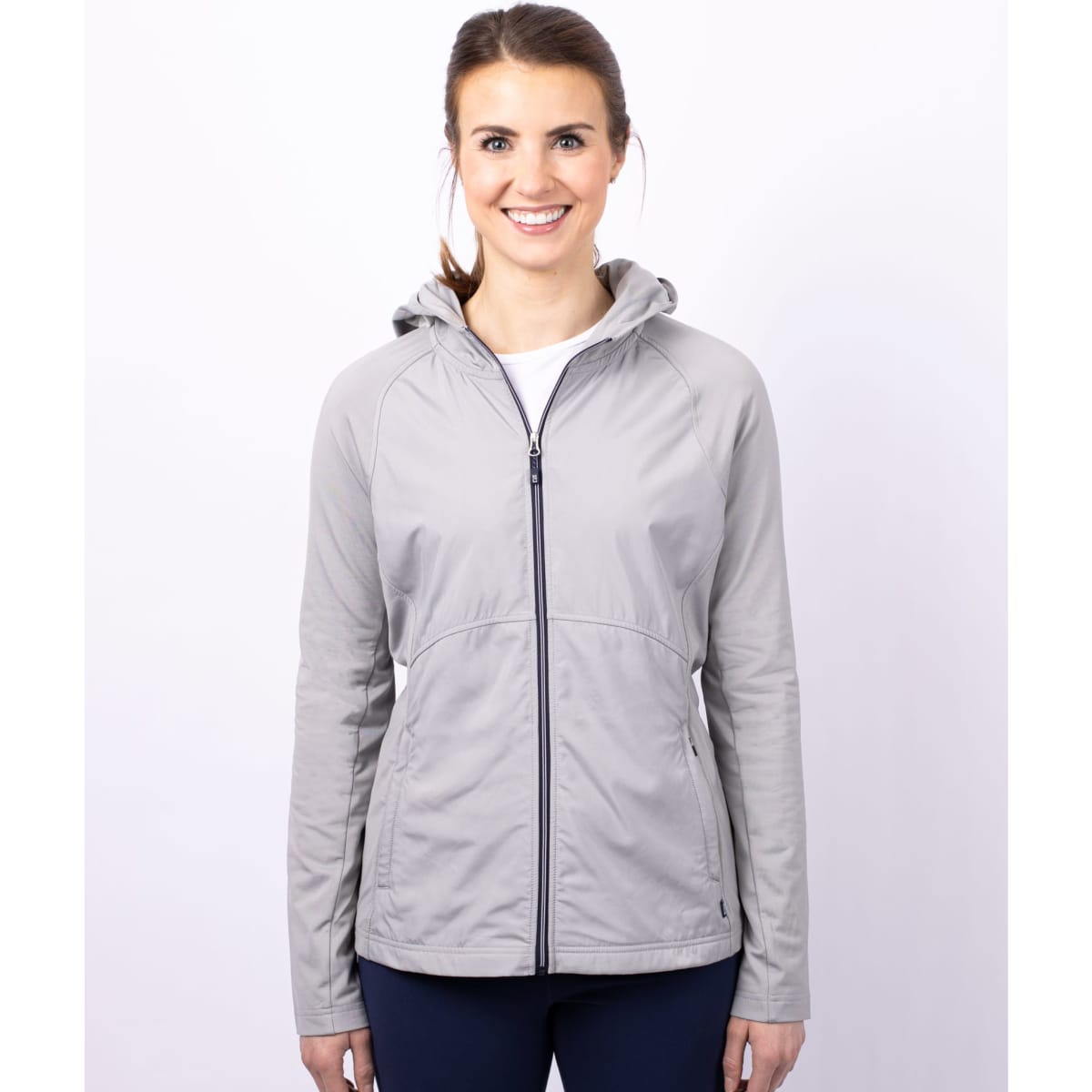 A grey full zip ladies' jacket with a hood, featuring a branded logo on the front.