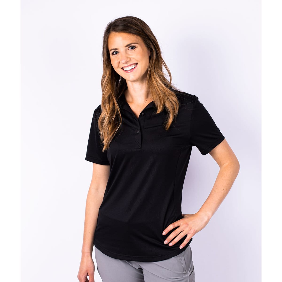 A black ladies polo shirt features a collar and a fitted design, suitable for casual or semi-formal wear.