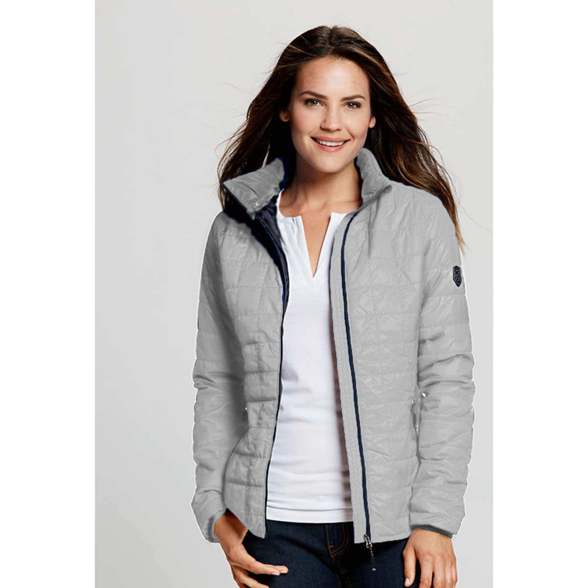 A lightweight, grey rain jacket with a zip front and high collar, featuring a simple logo on the sleeve.