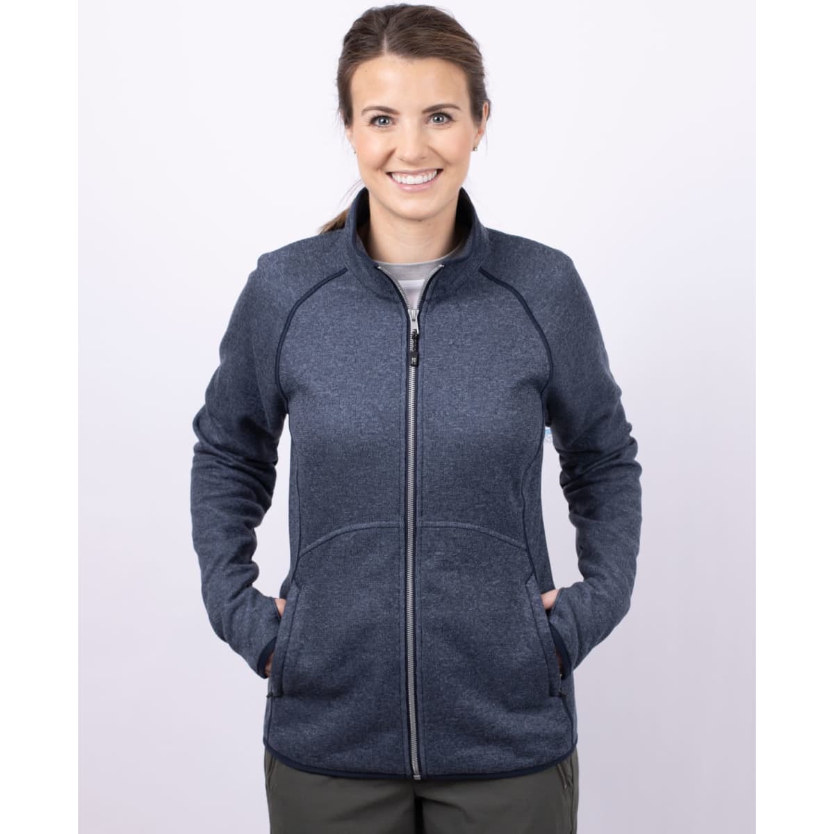 A full zip jacket in navy blue, featuring a sporty design and pockets, suitable for women's outerwear.