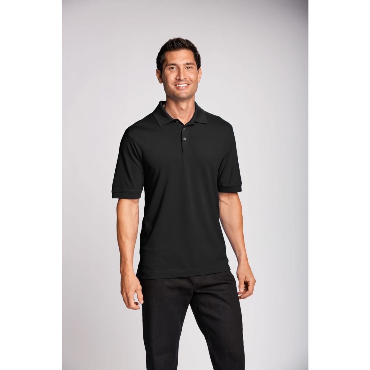 A black polo shirt with a collar, featuring a logo, worn by a smiling male model against a neutral background.