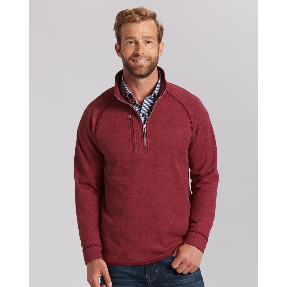 A men's half zip jacket in a rich burgundy colour, featuring a logo and a relaxed fit.