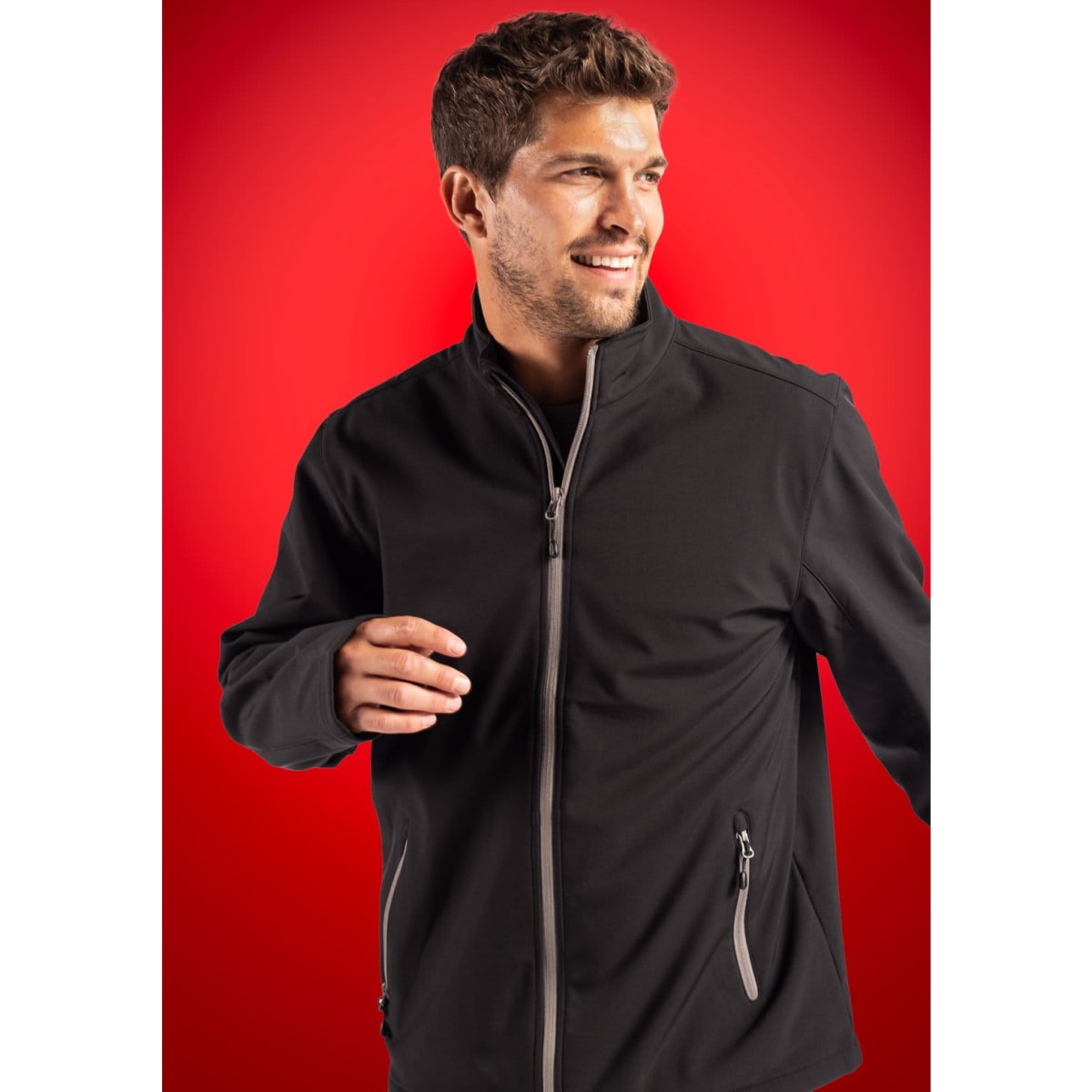 A black soft shell jacket with grey zippers, featuring a high collar and a fitted silhouette.