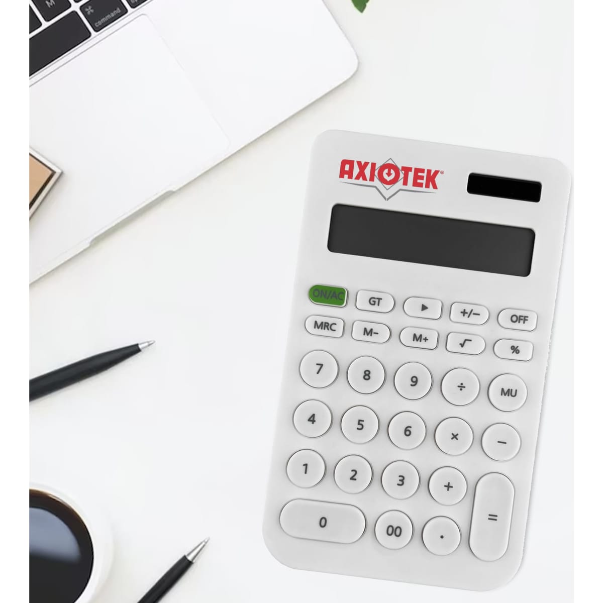 A white calculator with a logo, displaying numbers and various function keys, on a desk with a laptop and stationery.