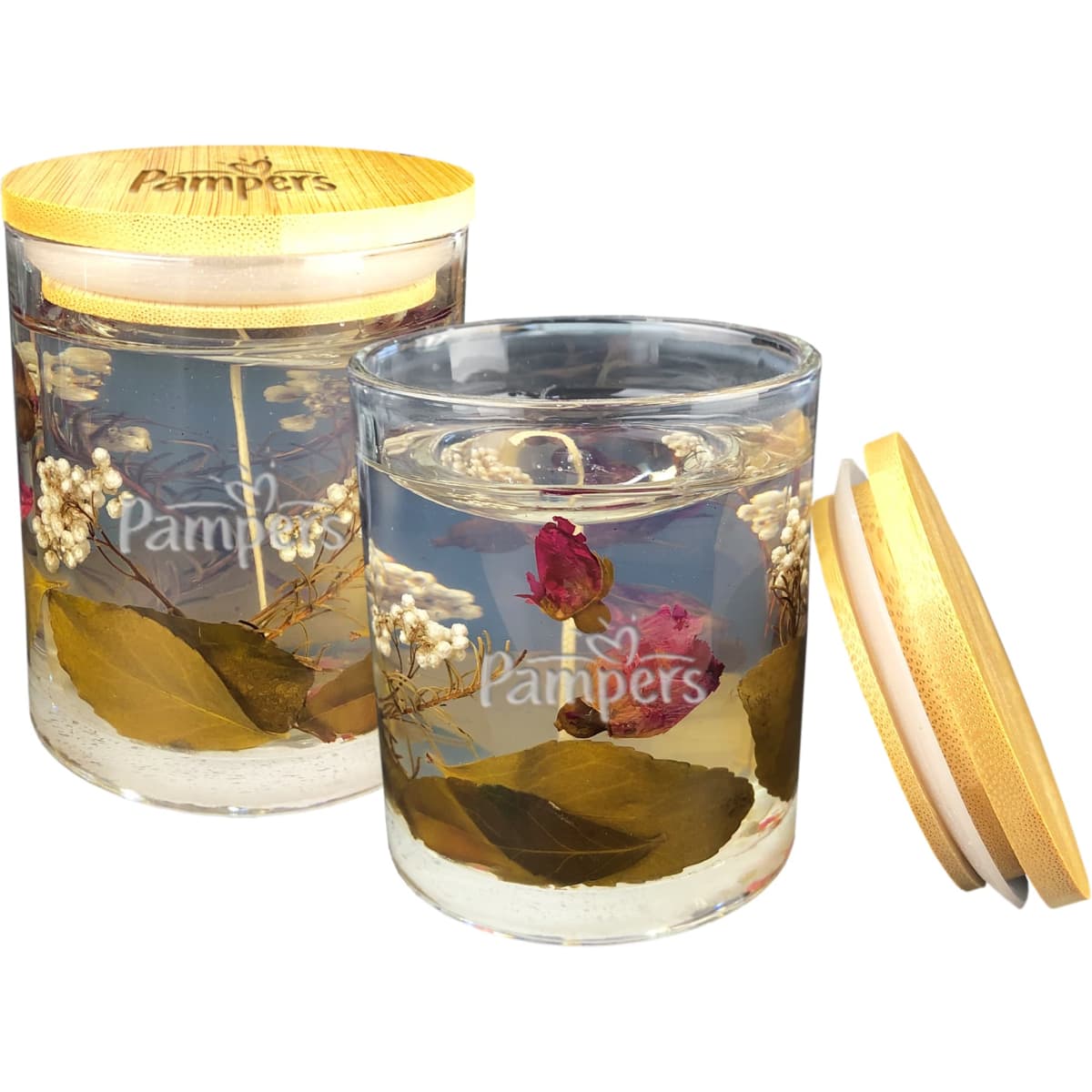 A floral candle in a glass jar, filled with preserved flowers and greenery, featuring a wooden lid.