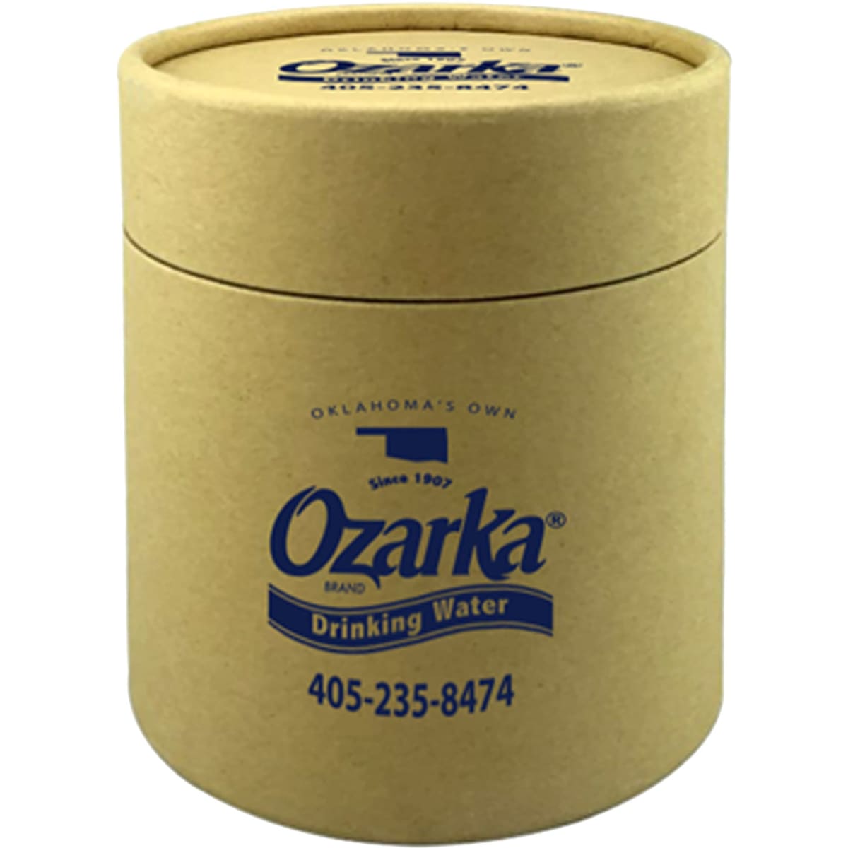A drink bottle in a small, cylindrical gift tube made of brown cardboard, featuring a logo and blue text.