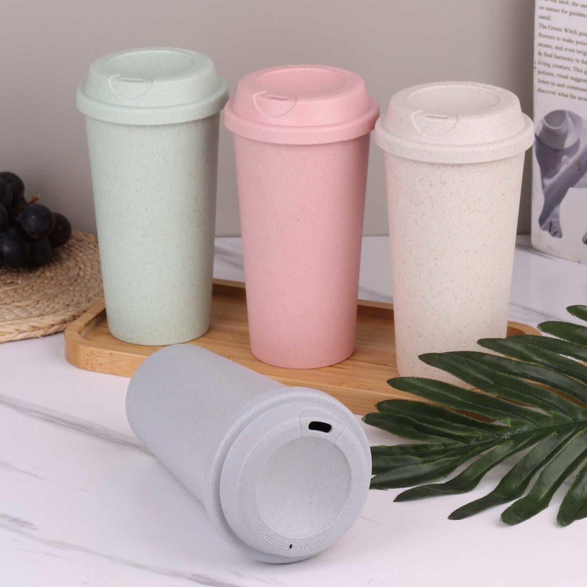 A drink bottle collection featuring reusable cups in mint green, pink, light grey, and cream with a logo.