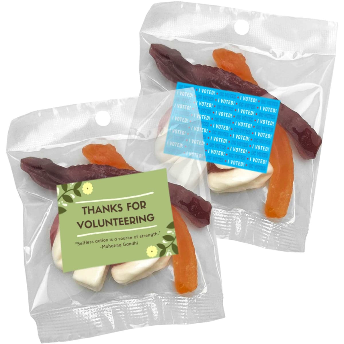A clear plastic bag containing mixed lollies, featuring red, orange, and white jelly treats. The bag has a label and a logo.