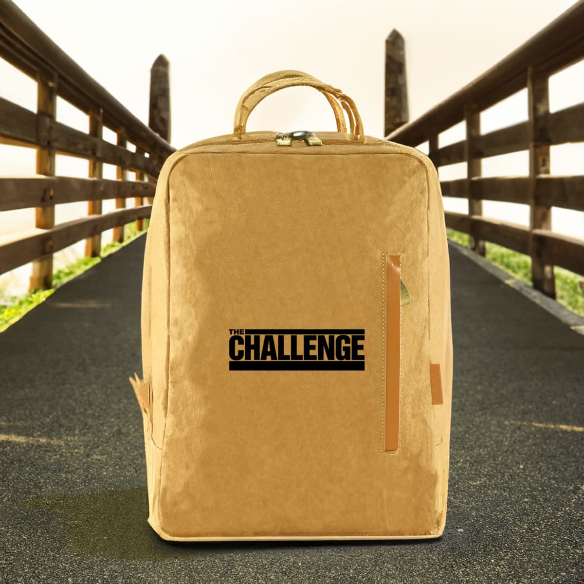 A yellow kraft paper laptop backpack with a textured finish and a front zipper, featuring a logo.