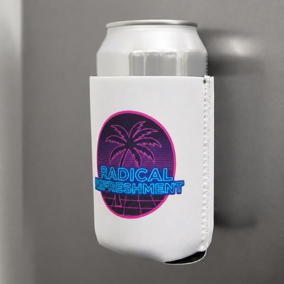 A drink bottle holder in white featuring a palm tree design, with a blue and pink logo, attached to a metallic surface.