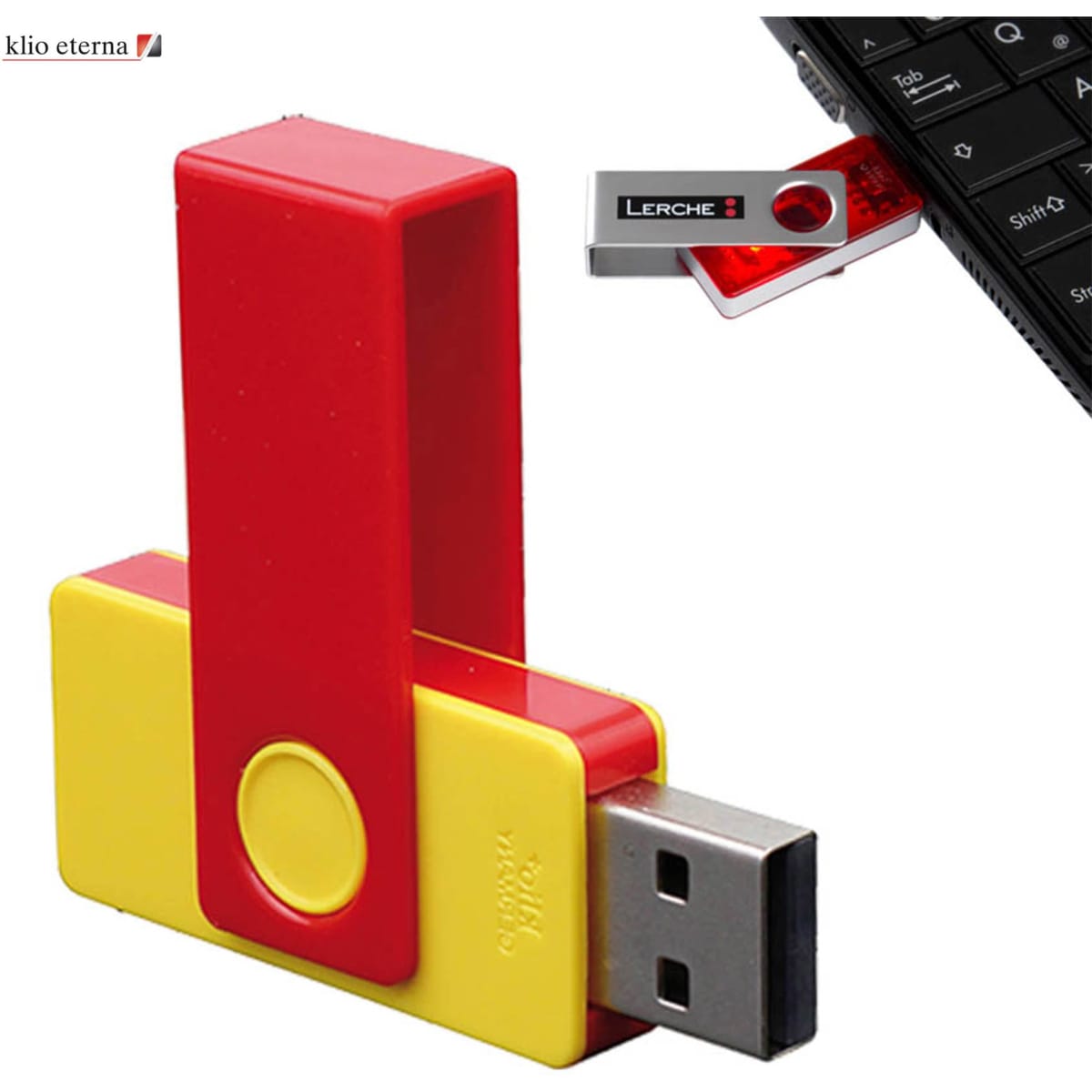 A red and yellow USB flash drive with a plastic clip, 32GB capacity, alongside a smartphone keyboard.
