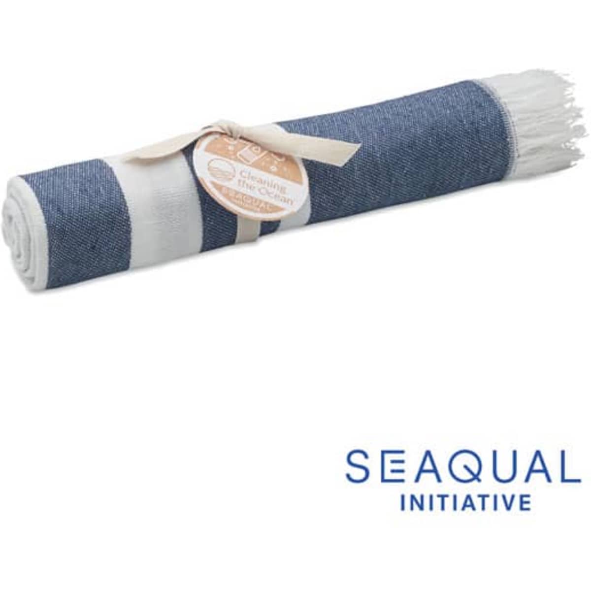 A rolled-up towel featuring a navy blue and white striped design, secured with a ribbon and a tag. It has a logo.