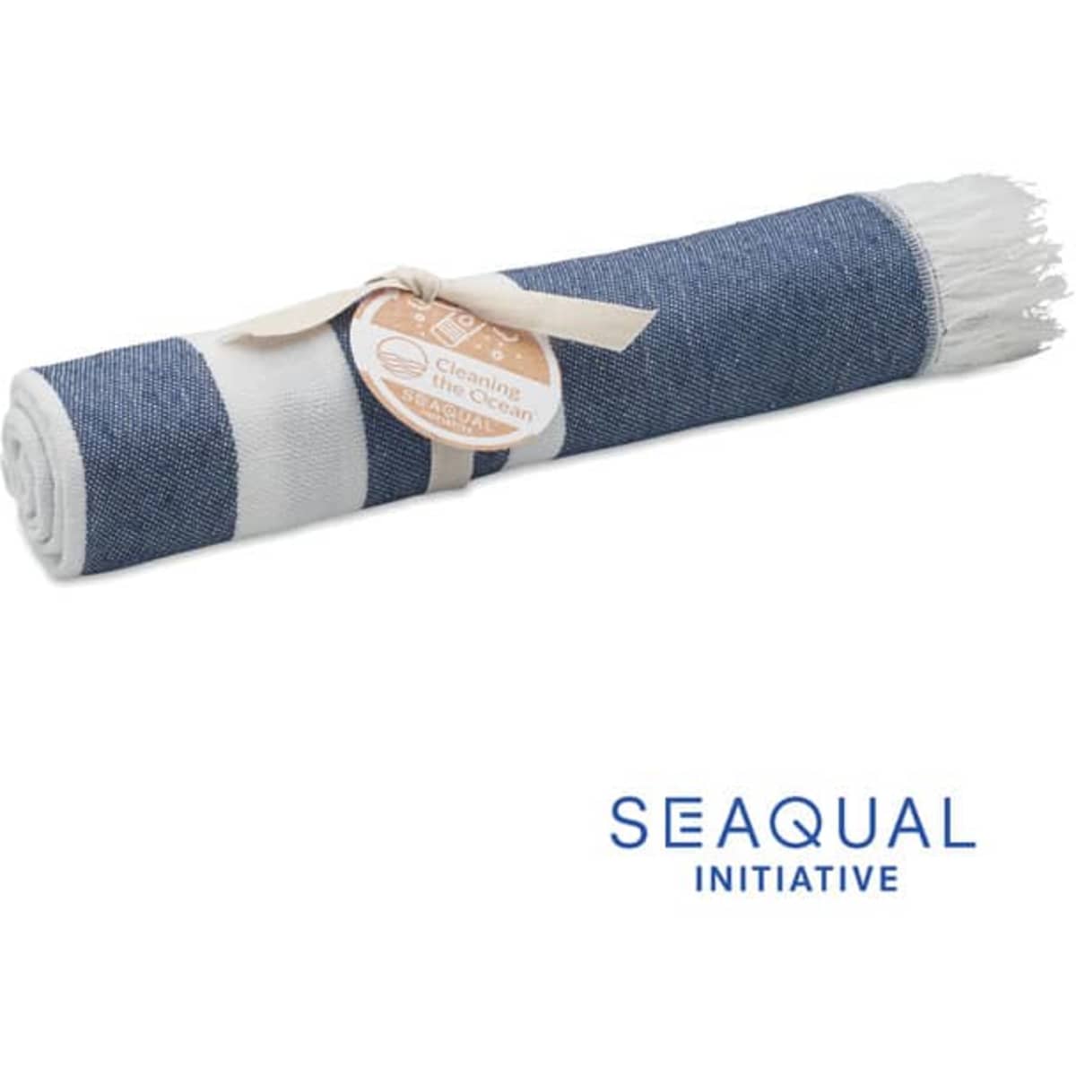 A rolled-up beach towel in a denim pattern, secured with a ribbon, featuring natural fibres and a tag.