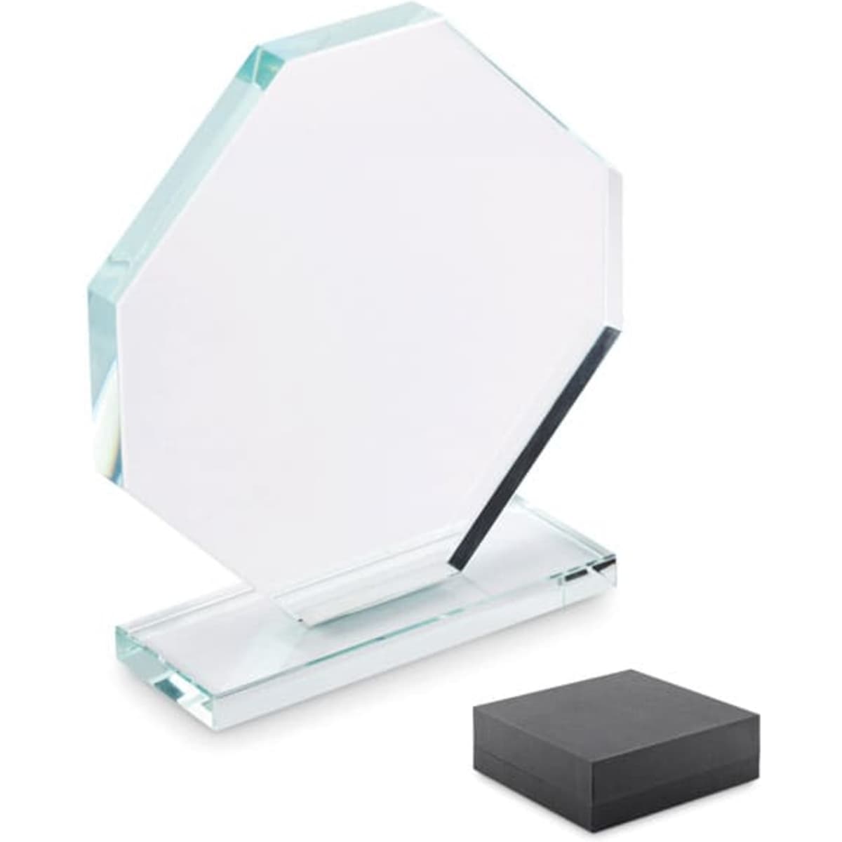 A clear glass award with an octagonal shape, set on a rectangular base, accompanied by a black presentation box.