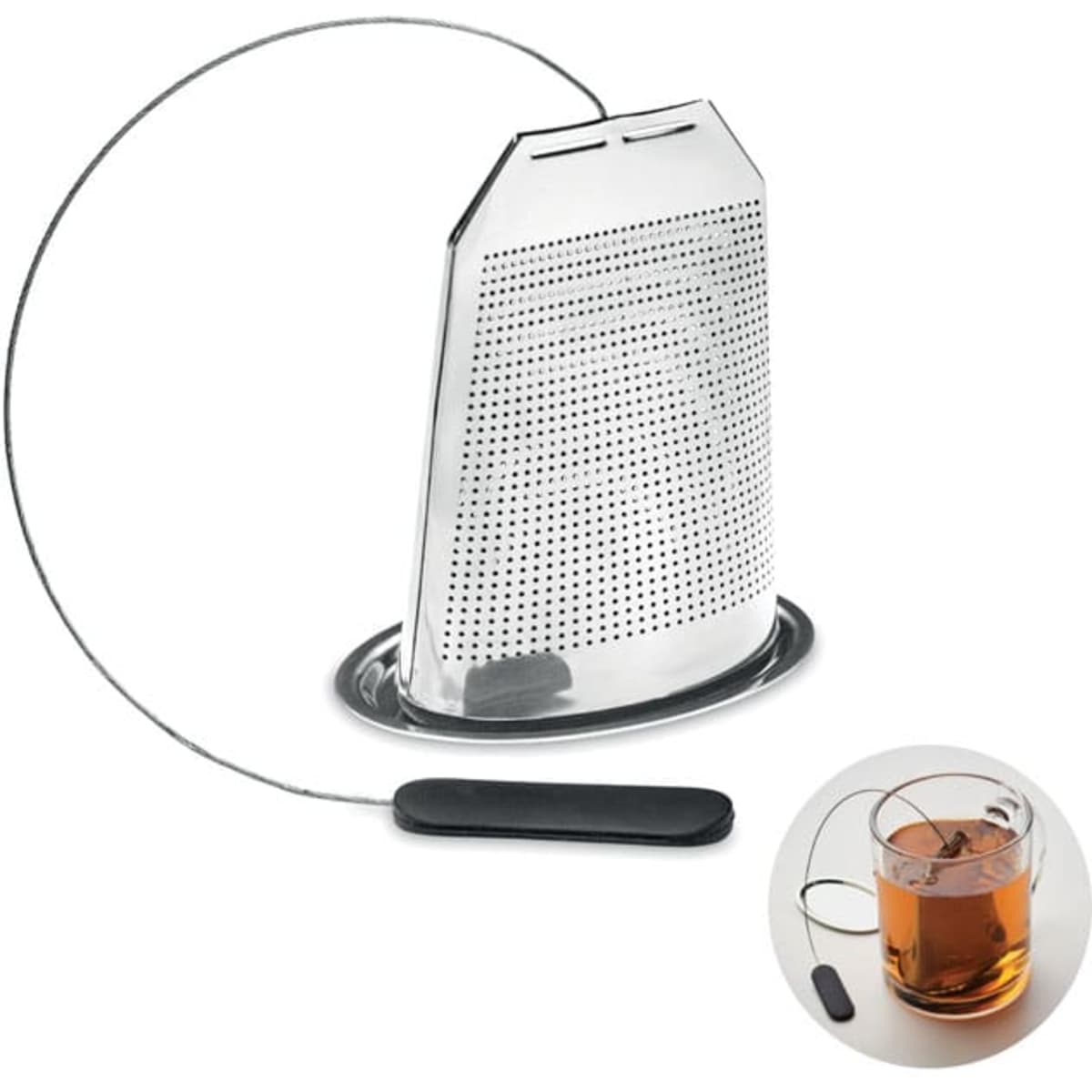 A tea infuser with a metallic mesh design, featuring a long wire and a black handle, beside a cup of tea.